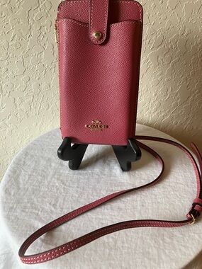 Coach: Raspberry Pink Pebbled Leather North/South Crossbody Phone Bag
